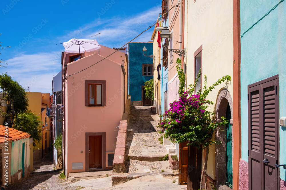 Bosa, Sardinia, Italy - Bosa historic old town quarter with colorful tenements and narrow street of Via Muruidda