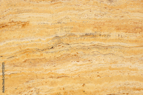 Natural stone travertine yellow color with an interesting pattern, called Travertino Giallo