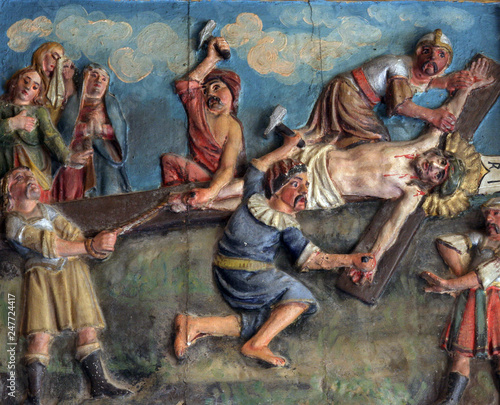Crucifixion: Jesus is nailed to the cross