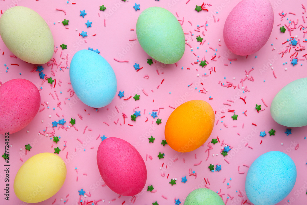 Colorful easter eggs with sprinkles on a pink background Colorful easter eggs with sprinkles on a pink background