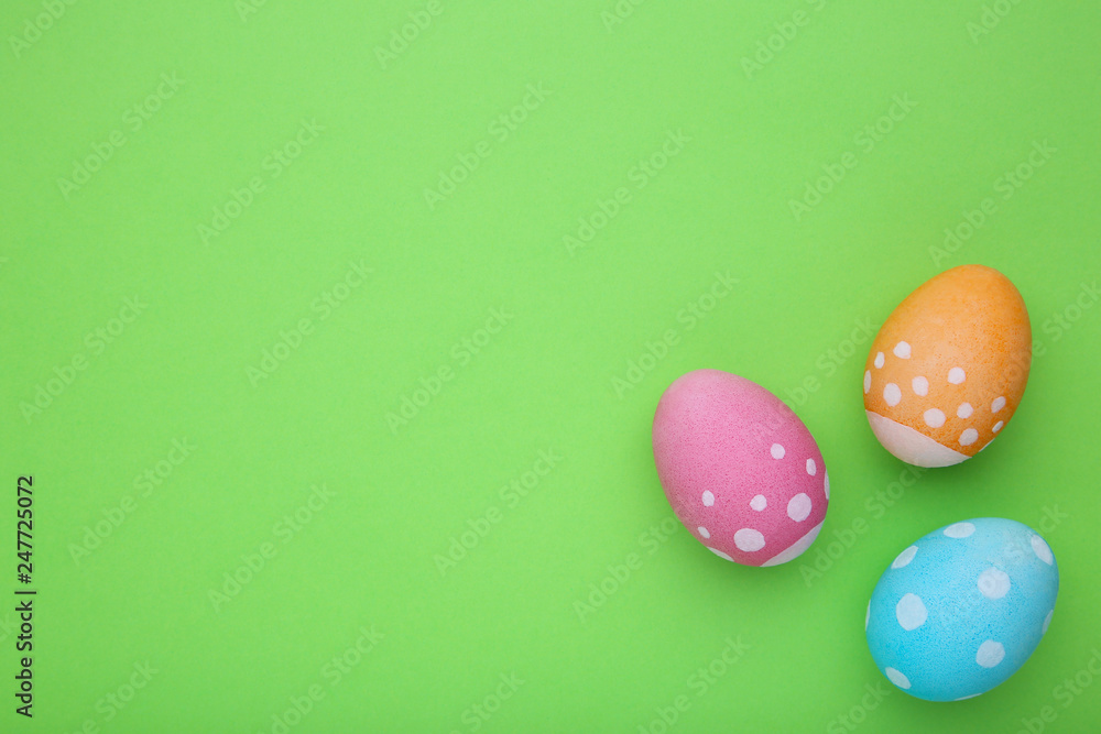 Colorful easter eggs on a green background