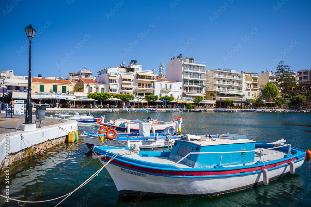 CRETE - JULY 03: Boats in the harbor of Agios Nikolaos, the most picturesque city in Crete on July 03, 2017. Crete, Greece.