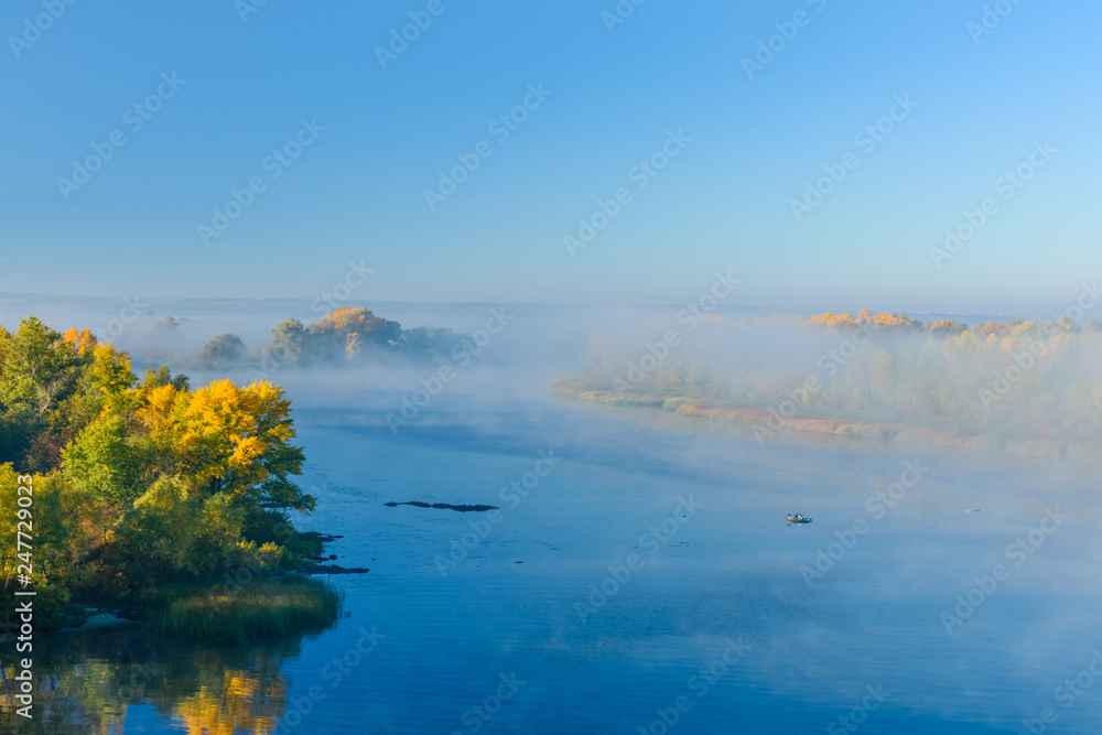 Fog over the water on a river Dnieper on autumn