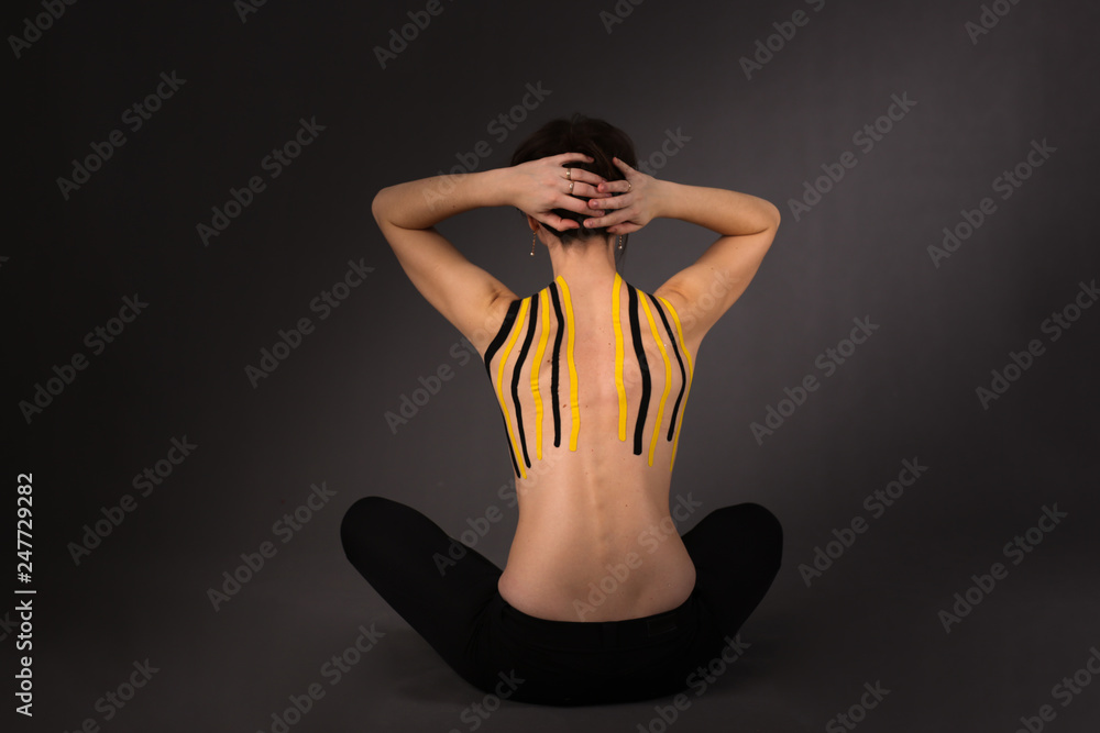 Obraz premium Medical taping. slim woman girl with dark hair