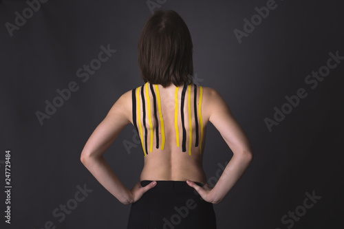 Medical taping. slim woman girl with dark hair