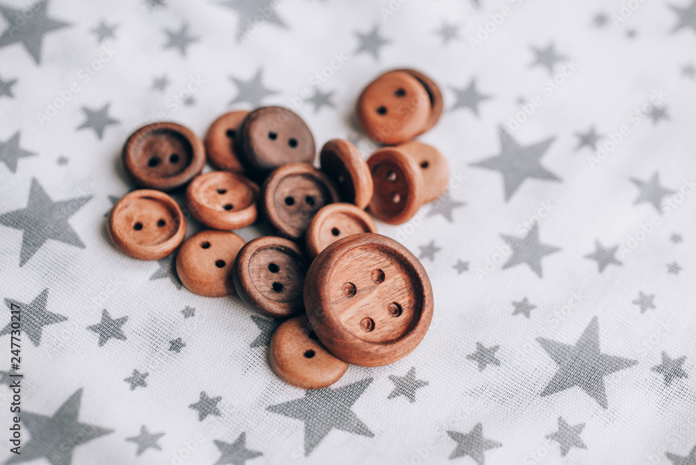 handmade wooden buttons on beautiful cotton fabric handmade wooden buttons on beautiful cotton fabric