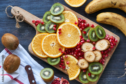 Wallpaper Mural Different slices of fresh fruit on a wooden cutting board Torontodigital.ca