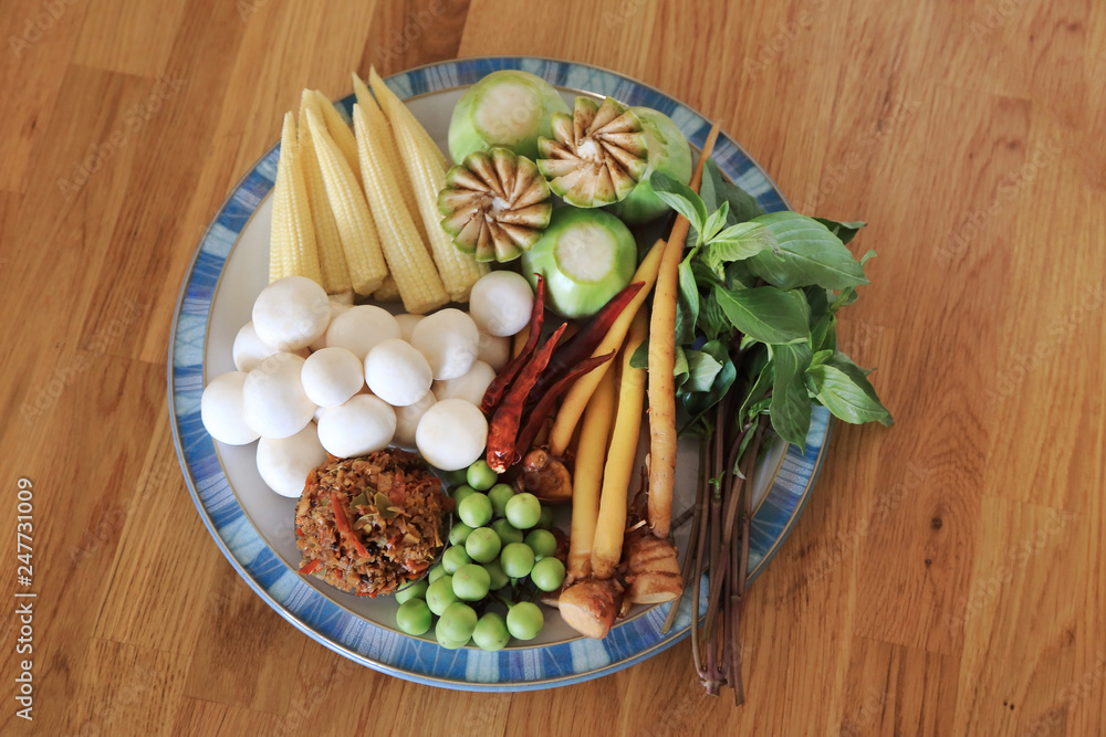 Raw ingredients with many kinds of herbs for vegan hot and spicy curry or jungle curry. Thai healthy recipe. Raw ingredients with many kinds of herbs for vegan hot and spicy curry or jungle curry. Thai healthy recipe.