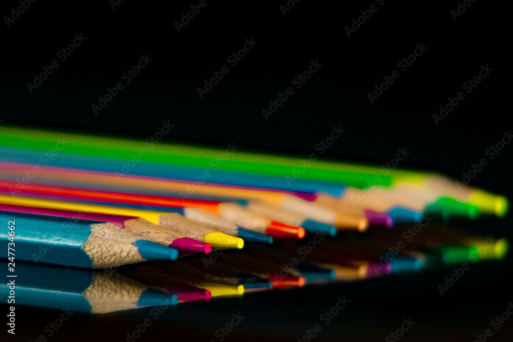 Reflex of color pencils on black background. A lot of colors. Reflex of color pencils on black background. A lot of colors.