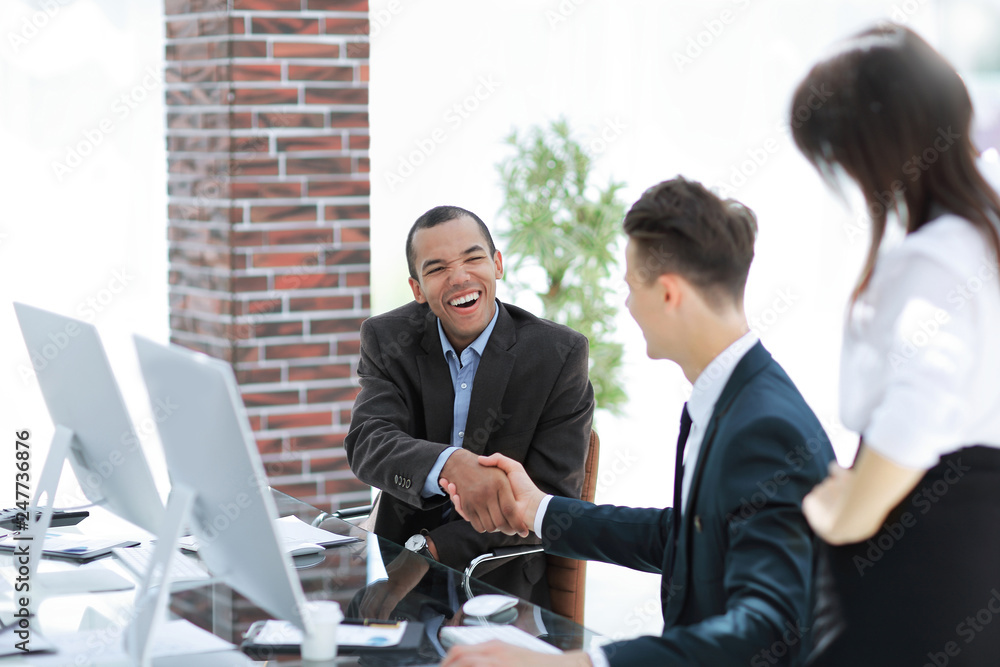 handshake international business partners on a Desk handshake international business partners on a Desk