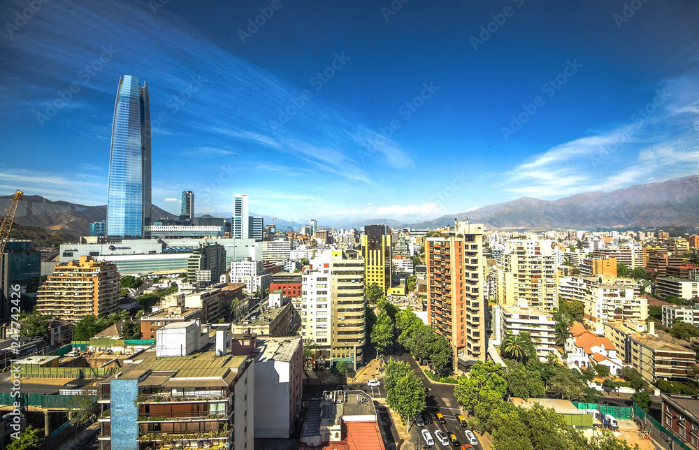 Naklejka premium Aerial view of a city and The Andes mountain in the background, Santiago, Chile