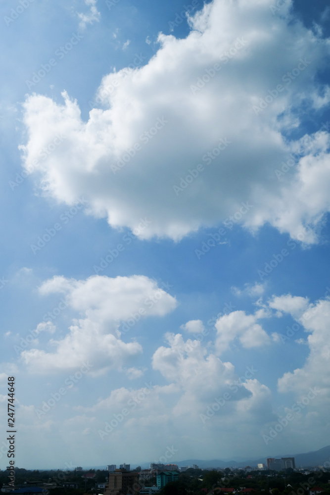 white cloud on clear blue sky above the city skyline white cloud on clear blue sky above the city skyline