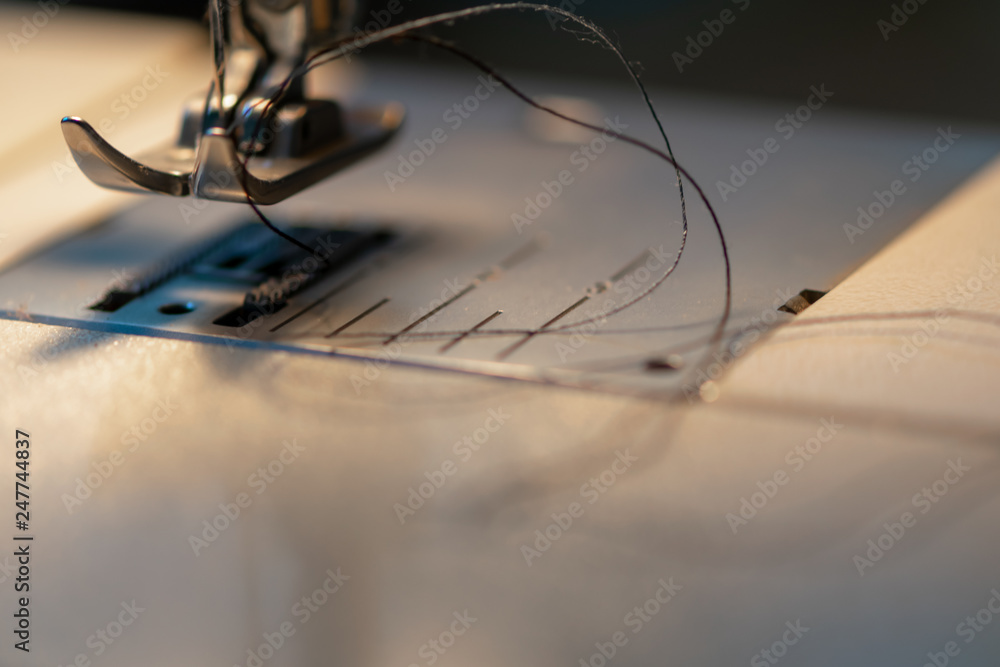 Sewing machine. Detail on thread and needle. Sewing machine. Detail on thread and needle.