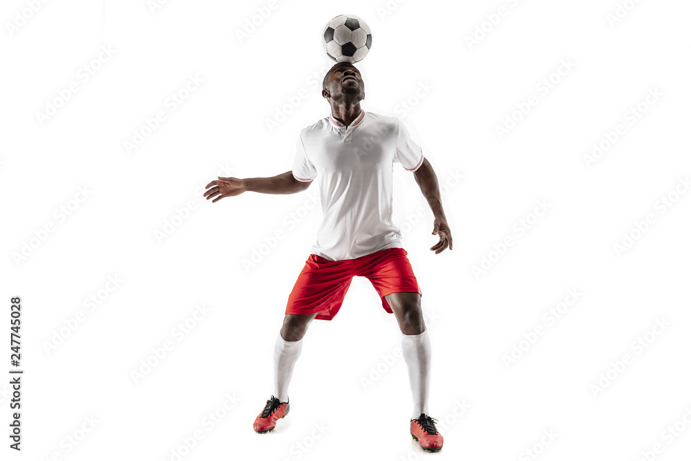 Professional african american football soccer player in motion isolated on white studio background. Fit jumping man in action, jump, movement at game. Professional african american football soccer player in motion isolated on white studio background. Fit jumping man in action, jump, movement at game.