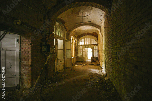 an old floor with open doors in an abandoned places at beelitz heilstätten