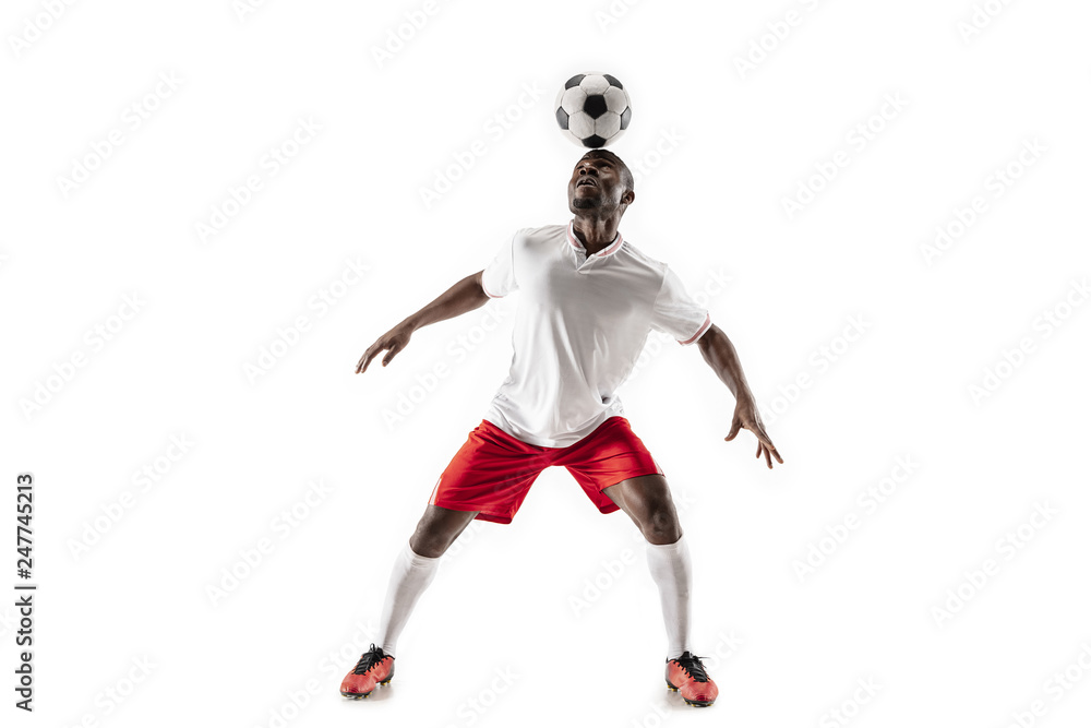 Professional african american football soccer player in motion isolated on white studio background. Fit jumping man in action, jump, movement at game. Professional african american football soccer player in motion isolated on white studio background. Fit jumping man in action, jump, movement at game.