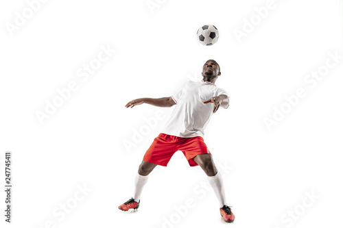 Fototapeta Naklejka Na Ścianę i Meble -  Professional african american football soccer player in motion isolated on white studio background. Fit jumping man in action, jump, movement at game.