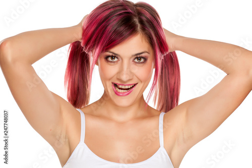 young seductive woman with pink hair on white background