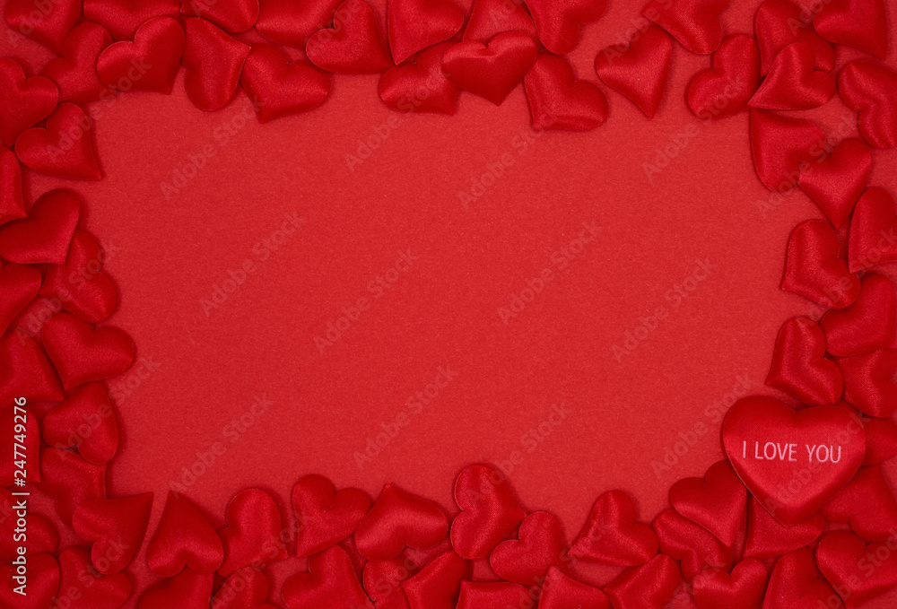 Red Valentines Day background. Red hearts boarder on red background. Top view, copy space.