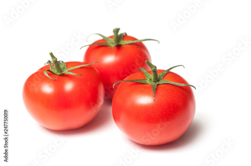 closeup of fresh tomatoes on white background