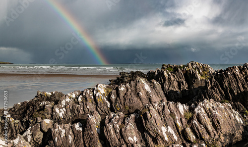 Scenic irish beach landscape rainbow reflection, the wild atlantic way on west coast of Ireland