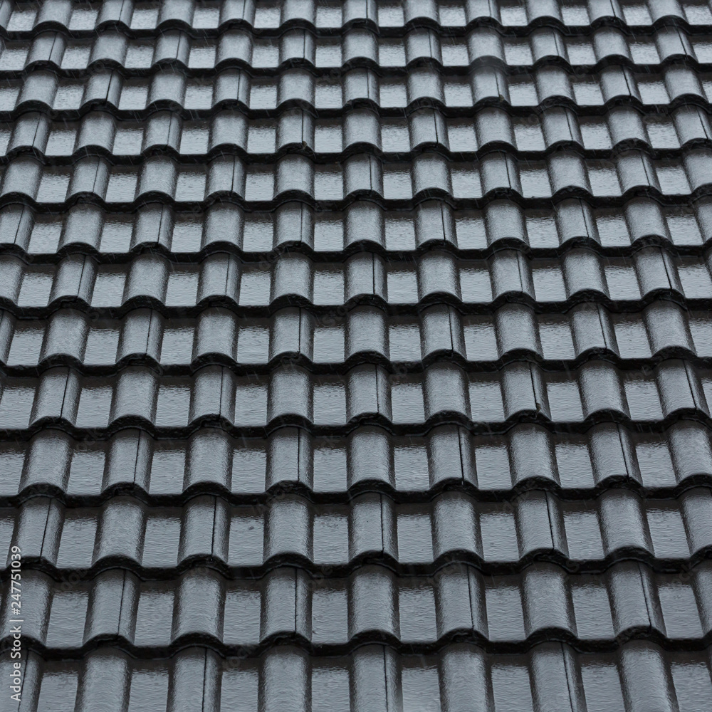 rain storm downpour on black roof tile of residential house rain storm downpour on black roof tile of residential house