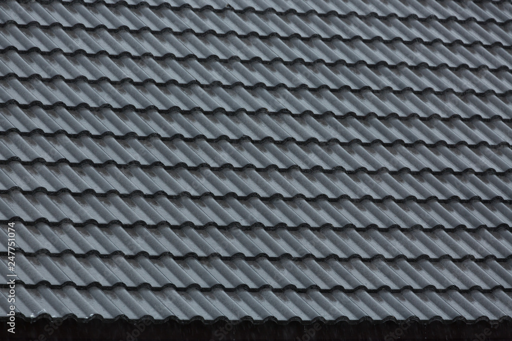rain storm downpour on black roof tile of residential house rain storm downpour on black roof tile of residential house