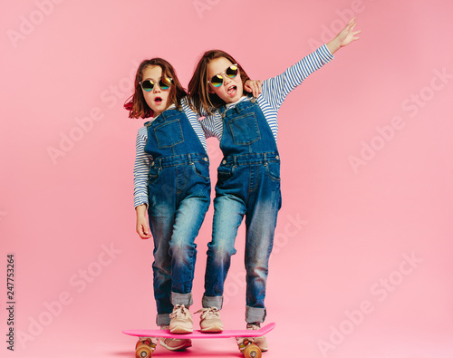 Stylish cute girls with skateboard