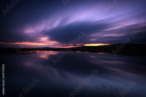 Long exposure on night sky and small lake in area of Nordgruvefeltet in middle Norway.