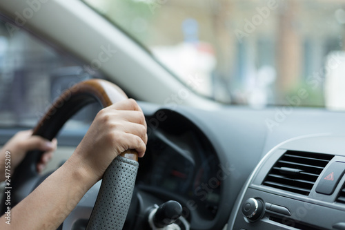 woman hand holding control steering wheel driving car road trips travel in the morning day