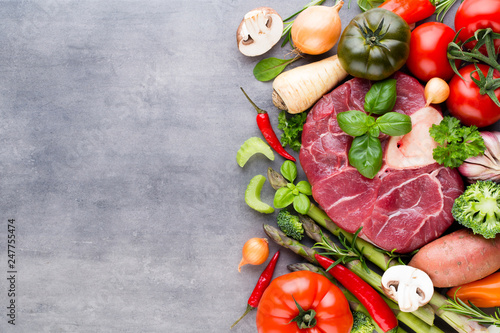 Quadro su tela Raw fresh meat Ribeye Steak with vegetables and spice.