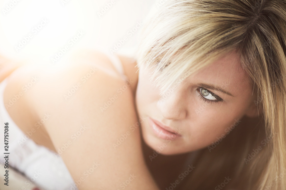 Blond girl posing in the interior photostudio Blond girl posing in the interior photostudio