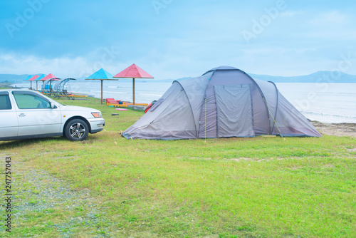 Seascape summer travel machine tent rubber boat Coastline horizon sky with clouds