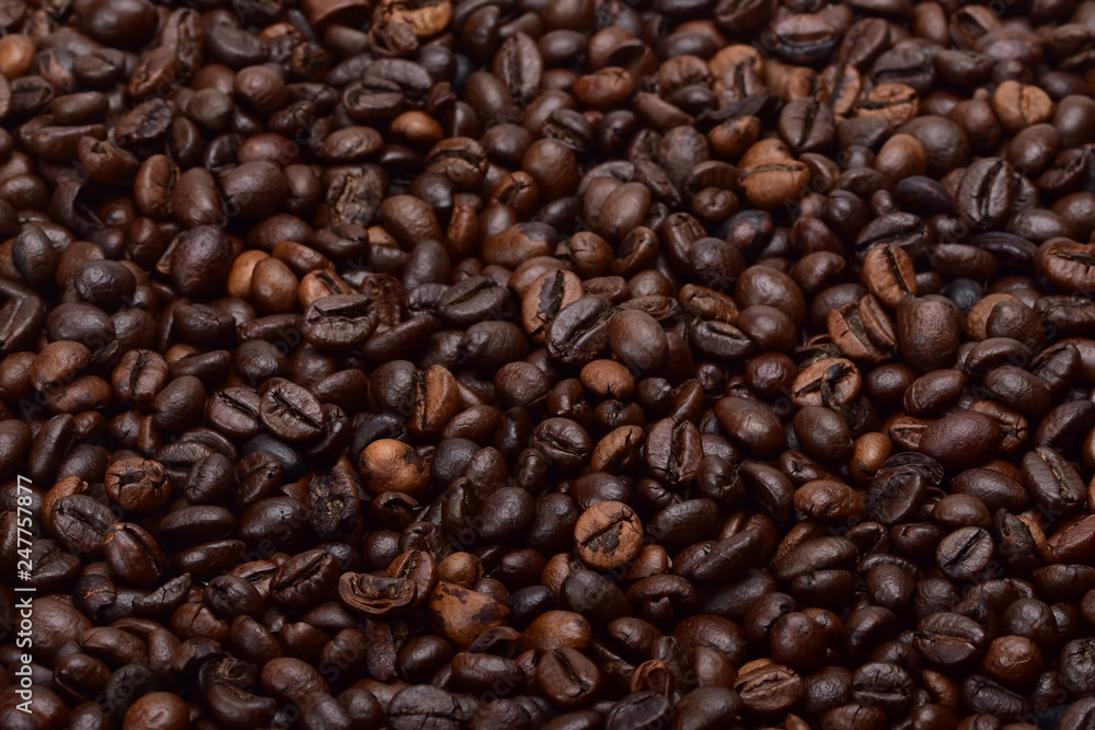 Texture of fresh roasted fragrant coffee beans. Ingredient for an invigorating morning drink Texture of fresh roasted fragrant coffee beans. Ingredient for an invigorating morning drink