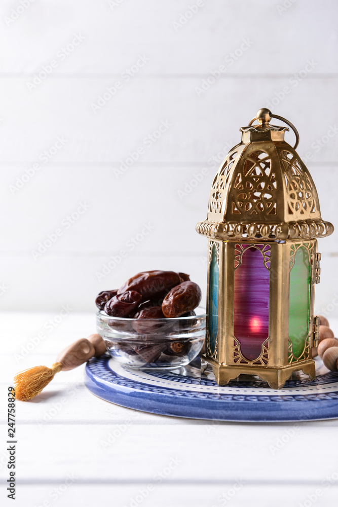 Composition with Muslim lamp on white wooden table
