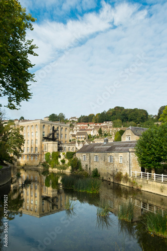 Picturesque homes climb the hill above the River Avon in autumn sunshine, Bradford on Avon, Wiltshire, UK