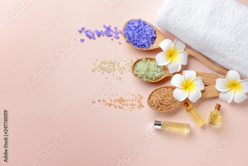 Spa composition with essential oil and sea salt on light background