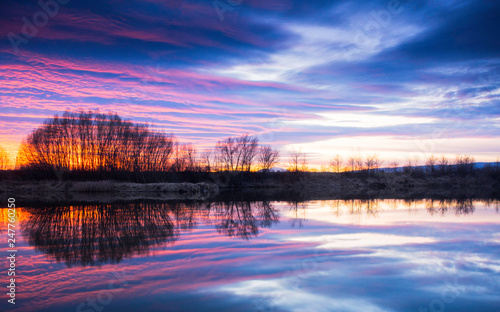 Stunning sunset with reflections on a lake