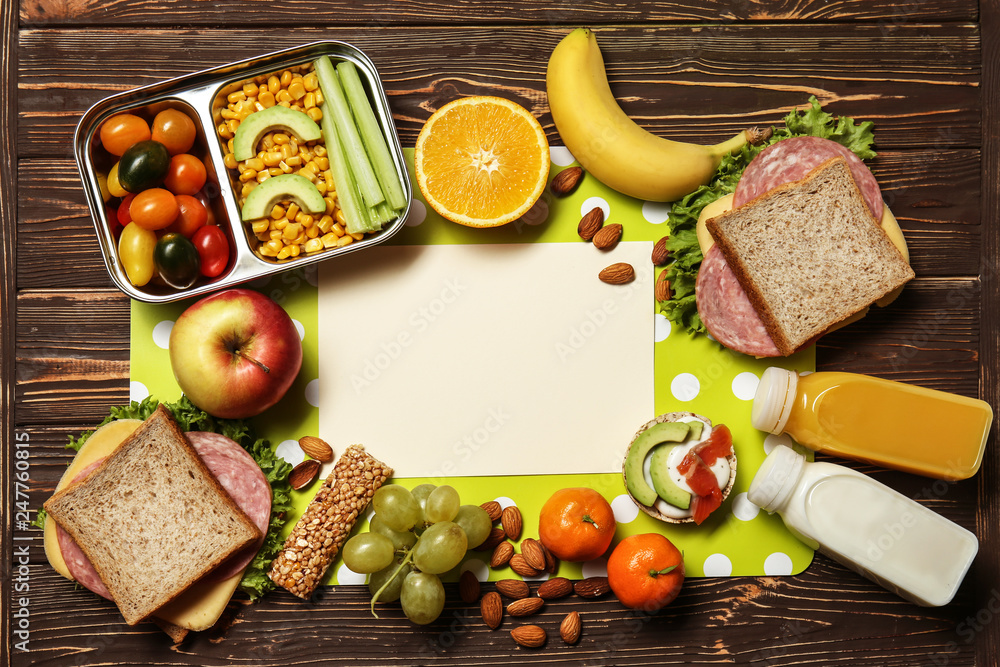 Frame made of tasty healthy food for kid on wooden background Frame made of tasty healthy food for kid on wooden background