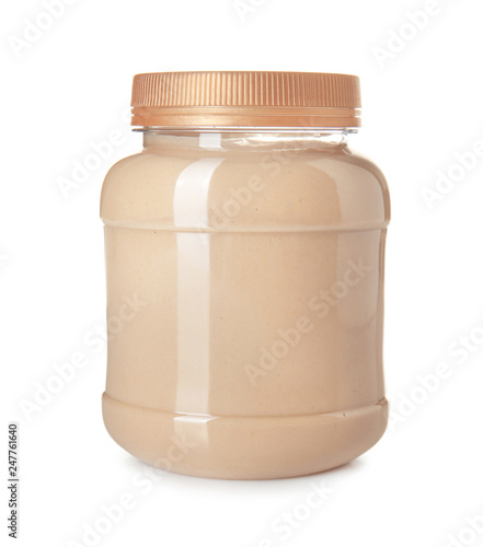 Jar of tasty tahini on white background