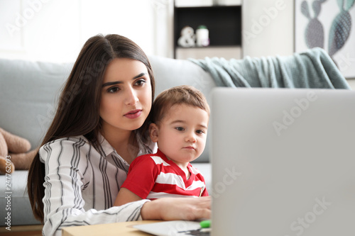 Young mother and toddler so...
