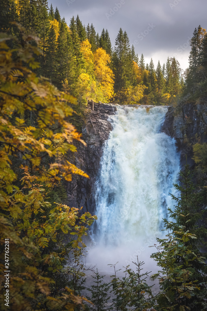 Big waterfalls in the forest. Autumnal landscape from Norway. Big waterfalls in the forest. Autumnal landscape from Norway.