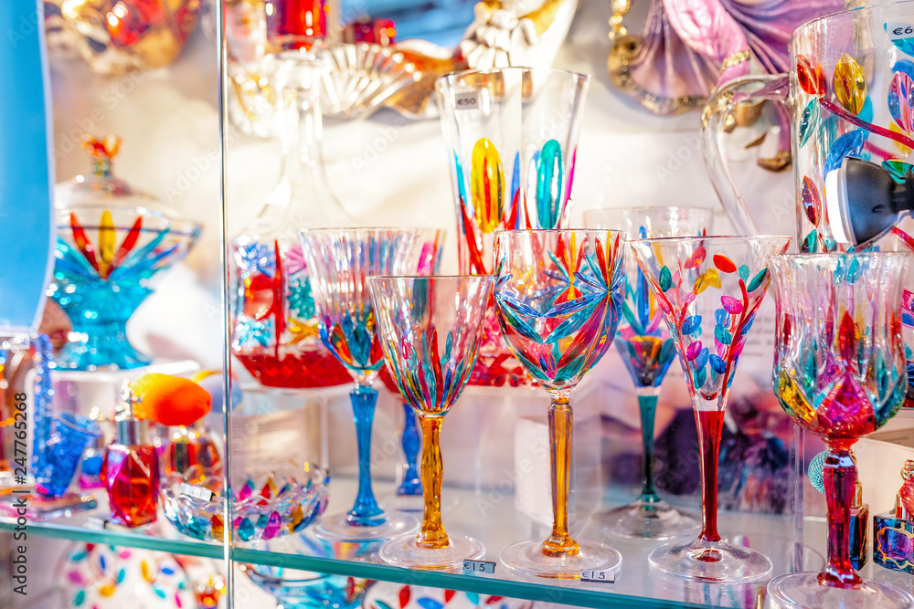 Colorful decorated objects made of a famous murano glass in a shop window in Venice