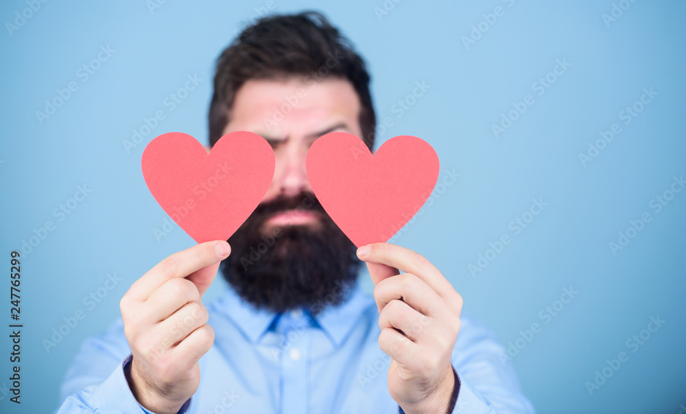 Making man feel loved. Man bearded hipster with heart valentine card. Celebrate love. Guy attractive beard and mustache in romantic mood. Feeling love. Dating and relations concept. Happy in love Making man feel loved. Man bearded hipster with heart valentine card. Celebrate love. Guy attractive beard and mustache in romantic mood. Feeling love. Dating and relations concept. Happy in love