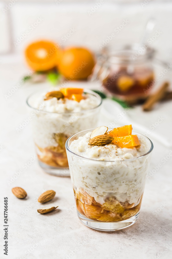 Overnight oats with tangerines and almonds. Selective focus, space for text.