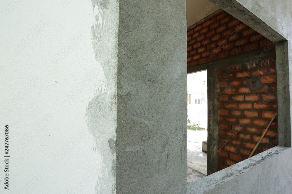 window frame on cement wall inside construction site building industry