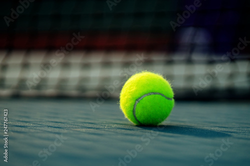 Tennis ball on the tennis court. © somchaip