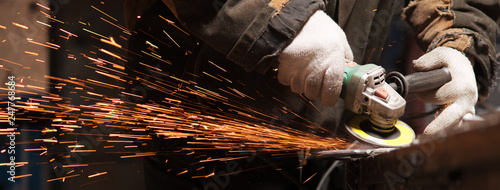 Blacksmith Polishes Metal Products Using A Grinding Machine