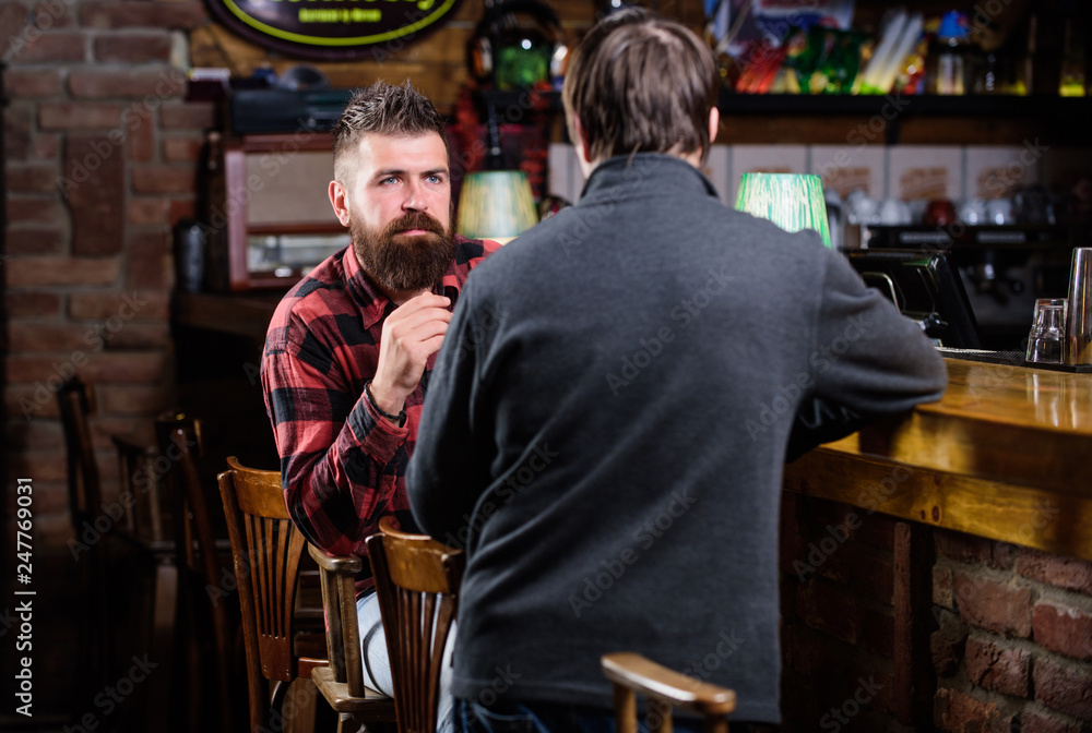 Friday relaxation in pub. Friends relaxing in pub. Friendly conversation with stranger. Hipster brutal bearded man spend leisure with friend bar counter in pub. Men relaxing in pub. Weekend leisure Friday relaxation in pub. Friends relaxing in pub. Friendly conversation with stranger. Hipster brutal bearded man spend leisure with friend bar counter in pub. Men relaxing in pub. Weekend leisure
