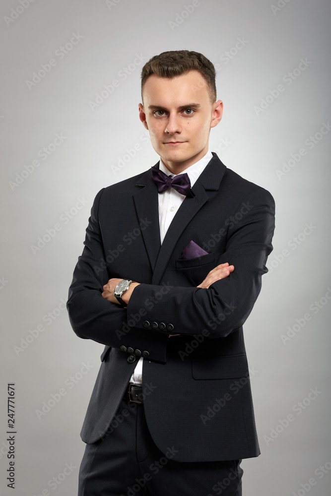 Young businessman on gray background Young businessman on gray background